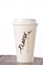 Takeaway coffee cup with Ã¢â¬ËXLargeÃ¢â¬â¢ written on it